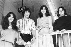 1980 Yearbook pg093 4 students by railing